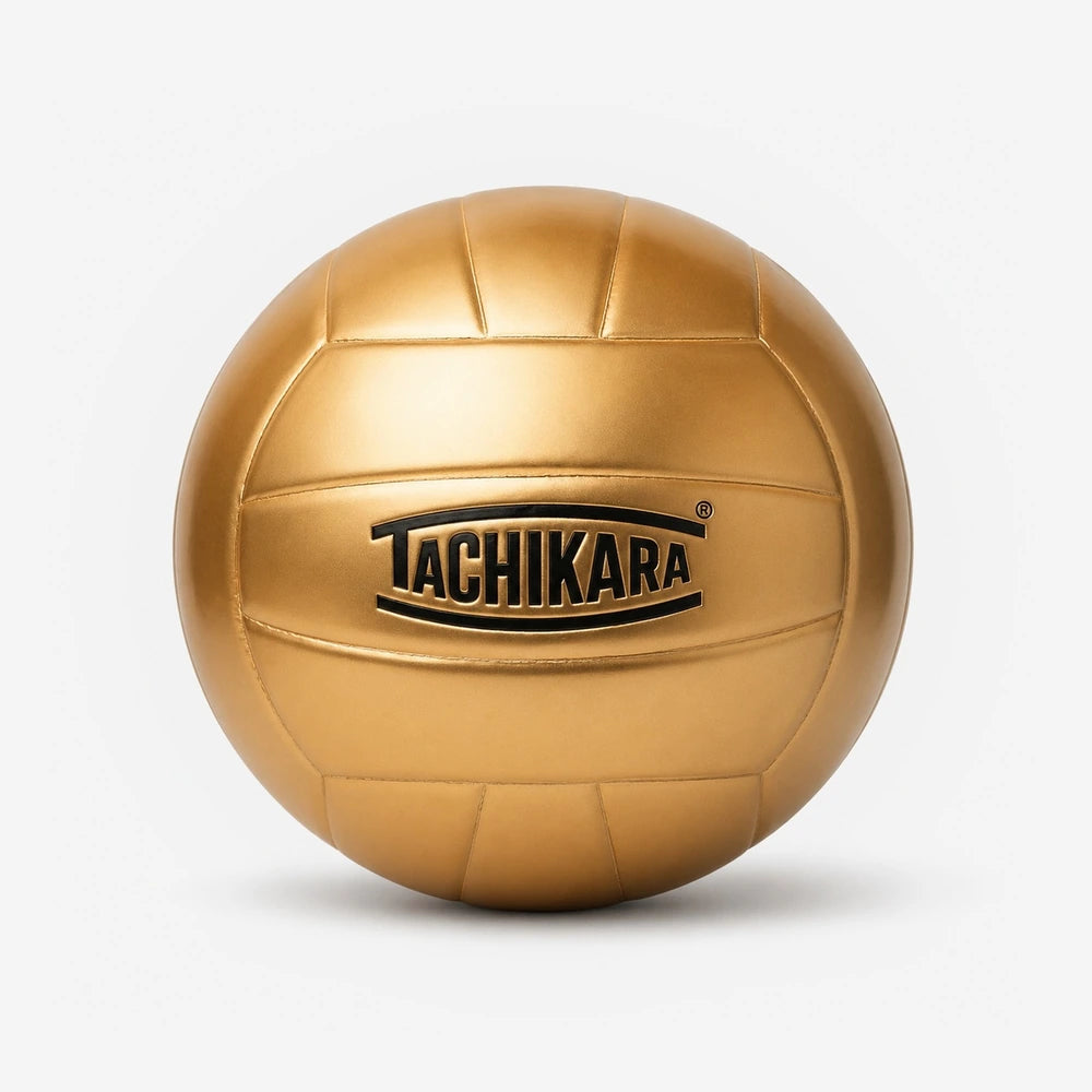 Gold Tachikara autograph volleyball on a white background