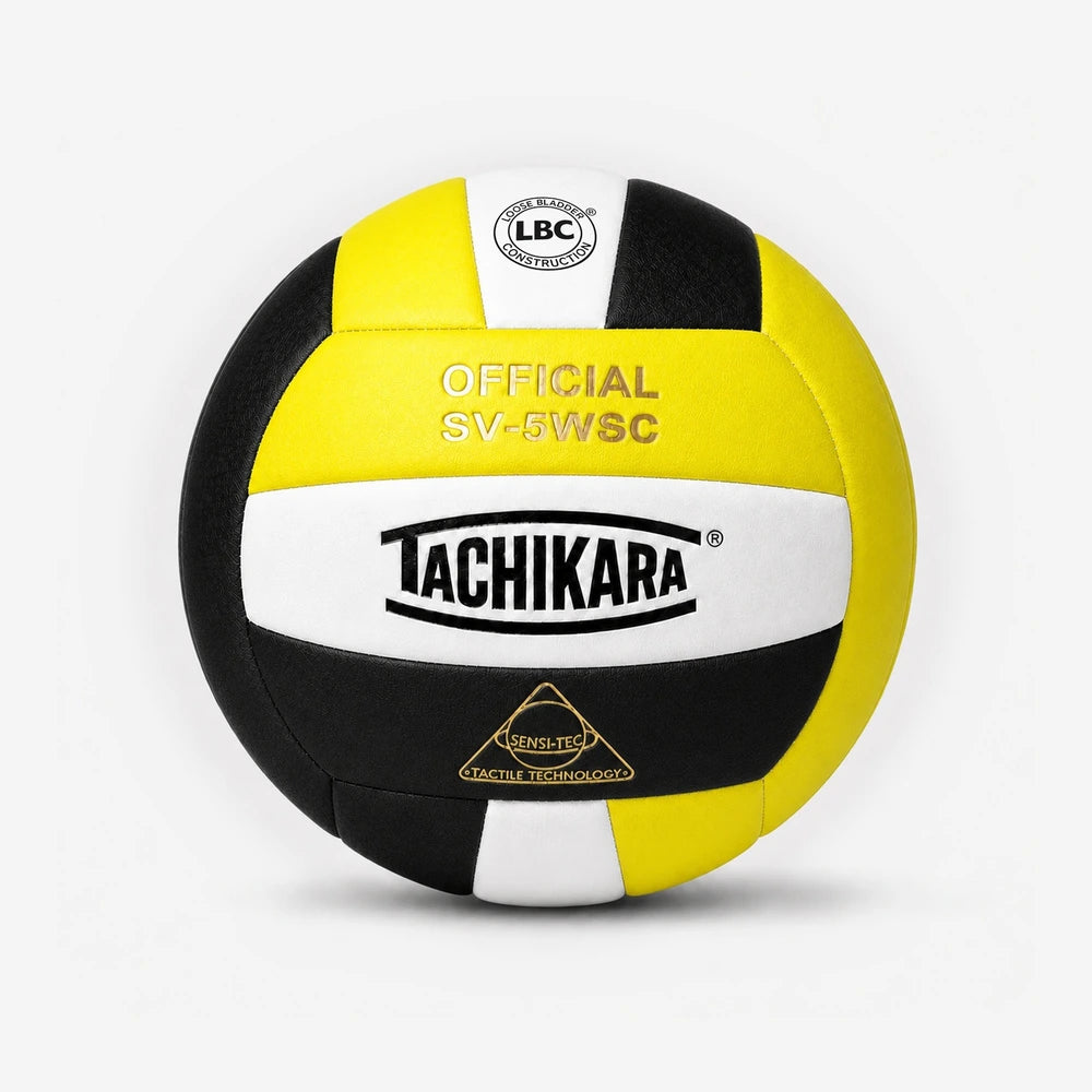 Tachikara volleyball with black, yellow, and white colors on a light gray background