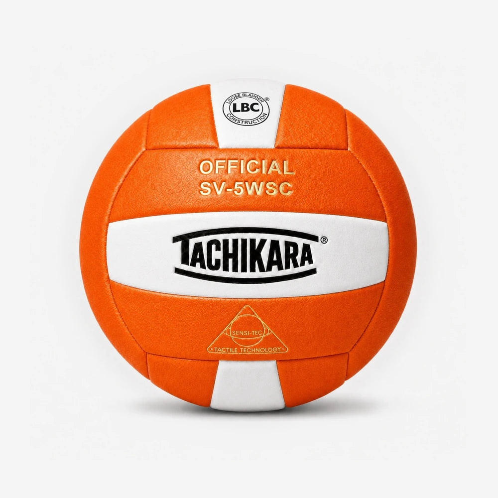 Orange and white volleyball with Tachikara branding on a light gray background