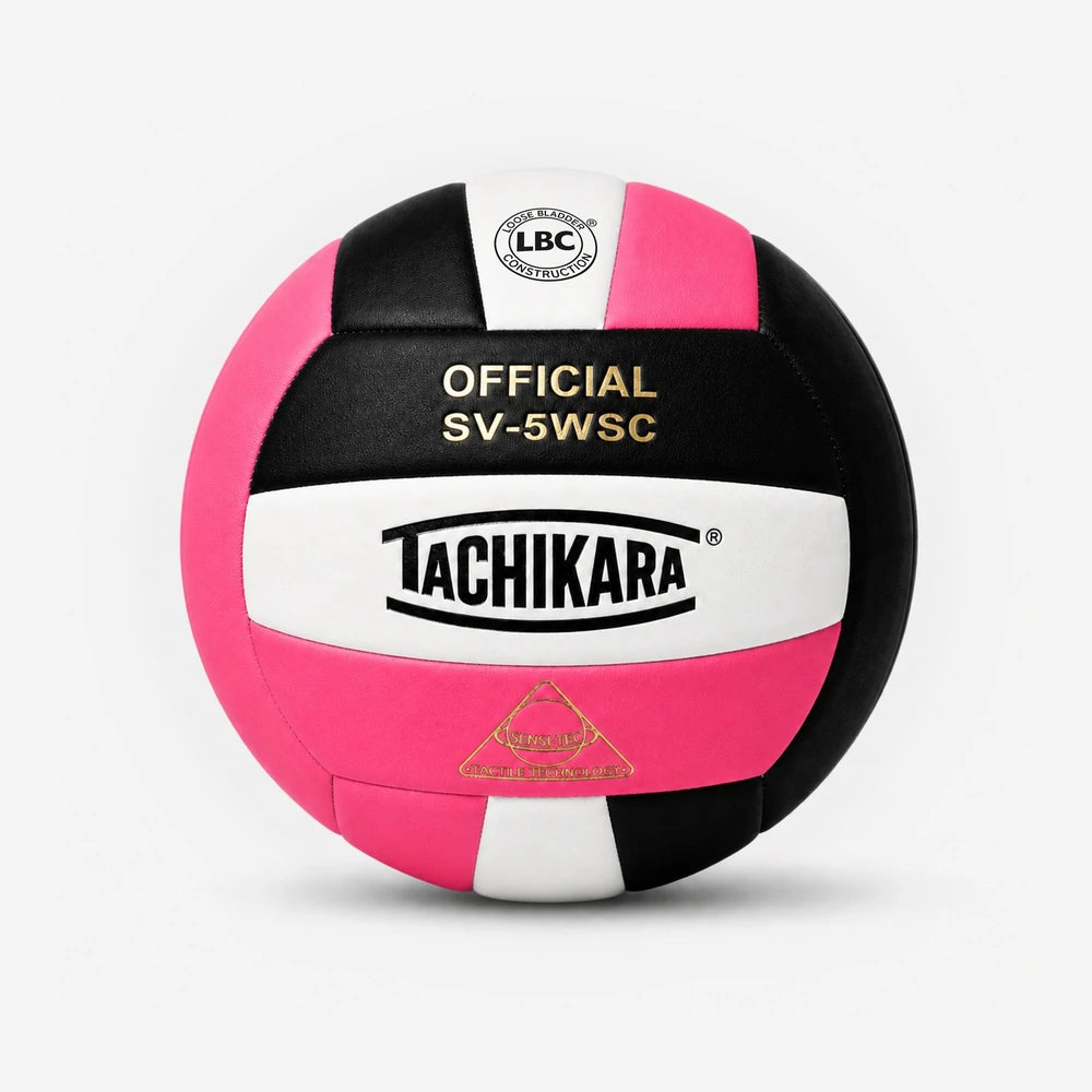 Pink, black, and white volleyball with Tachikara branding on a light gray background