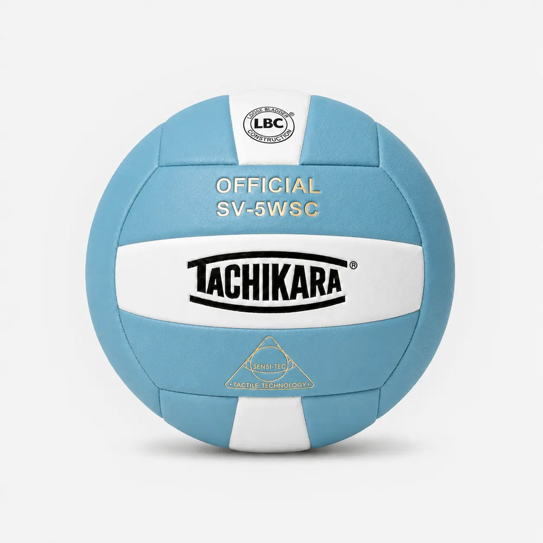 Blue and white volleyball with Tachikara branding on a light gray background