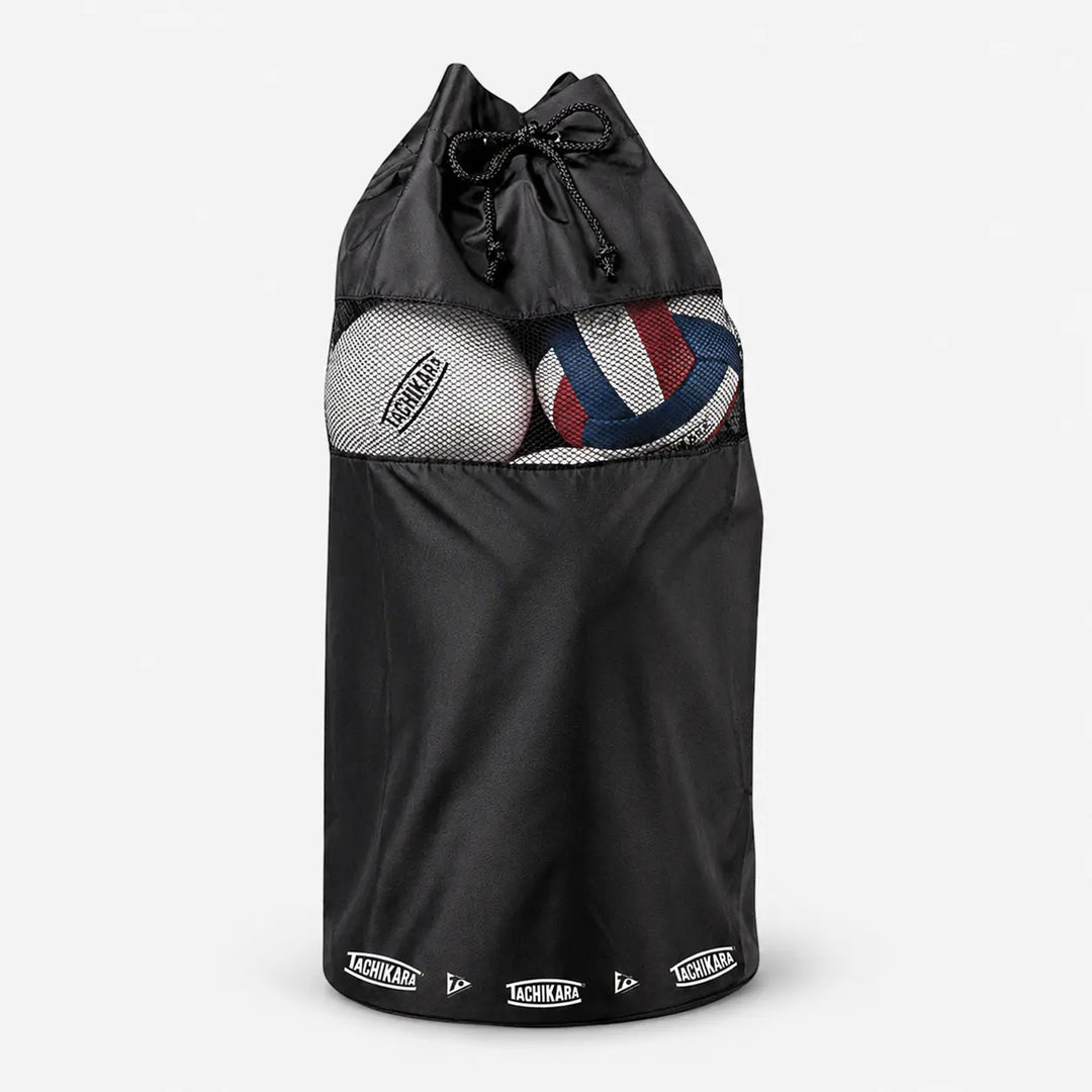 Black drawstring bag with volleyballs inside on a light gray background