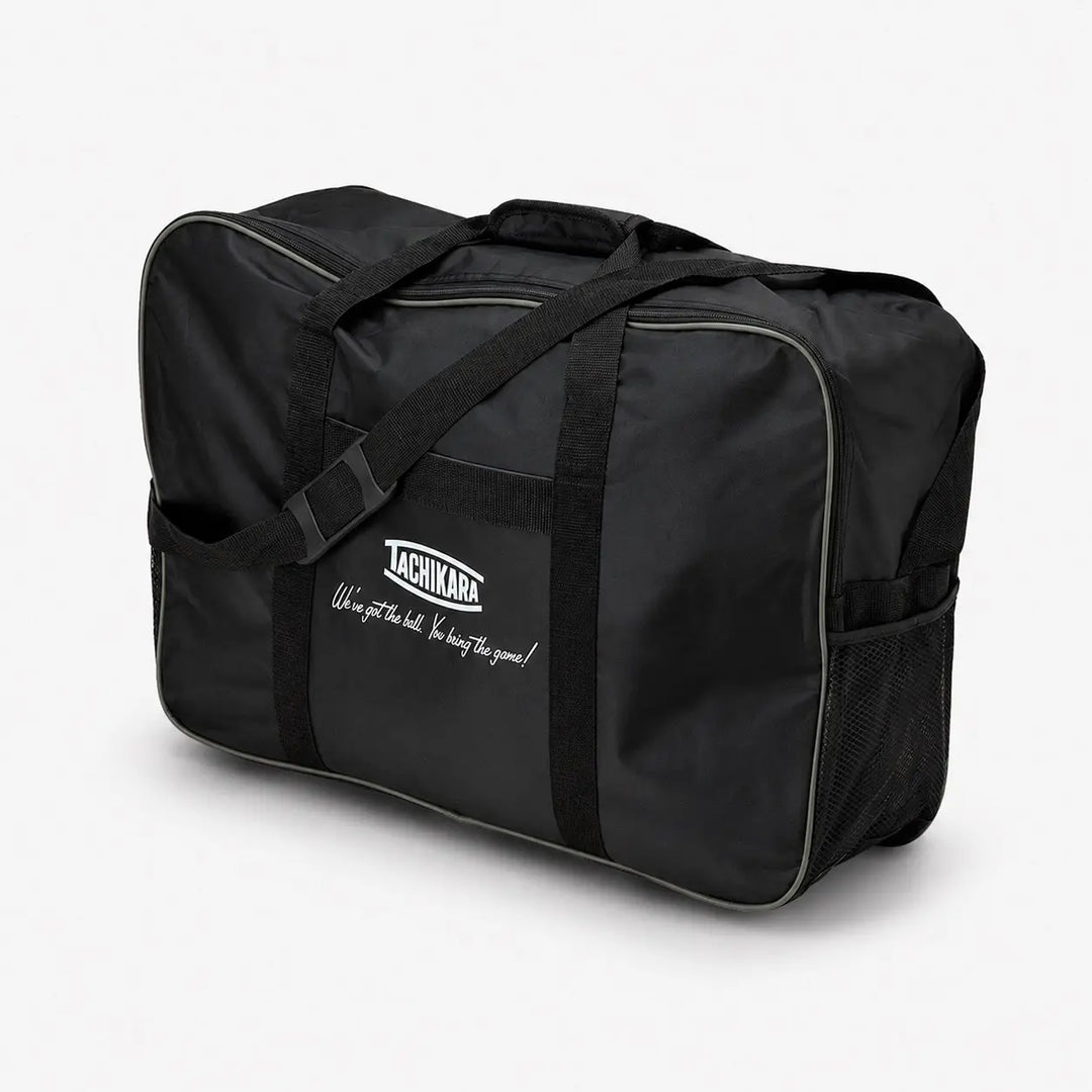 Black duffel bag with Tachikara logo on a white background