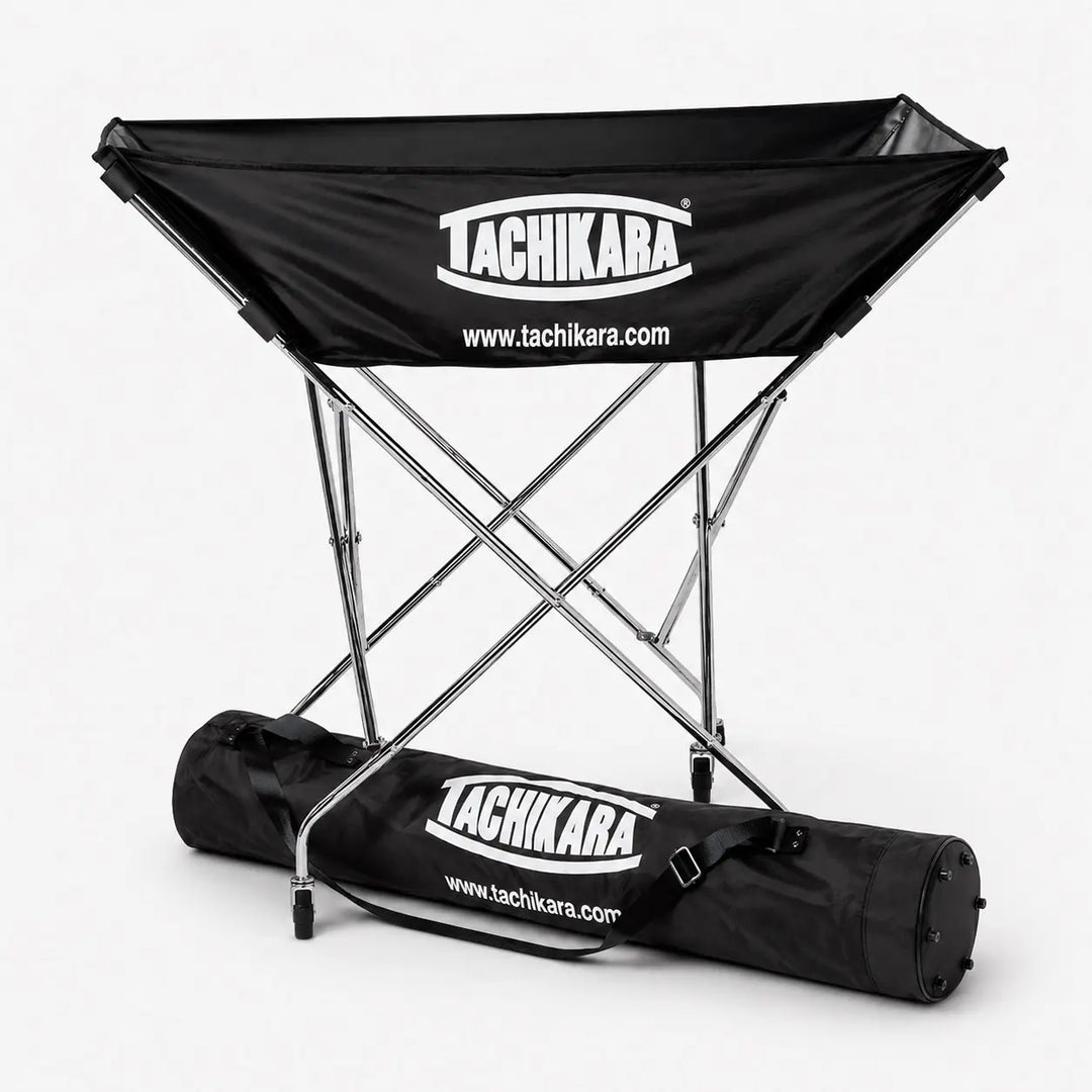 Black folding volleyball hammock with Tachikara branding on a white background