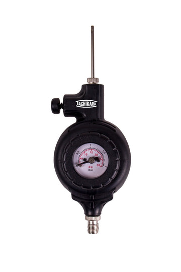 Black pressure gauge with a white dial on a white background